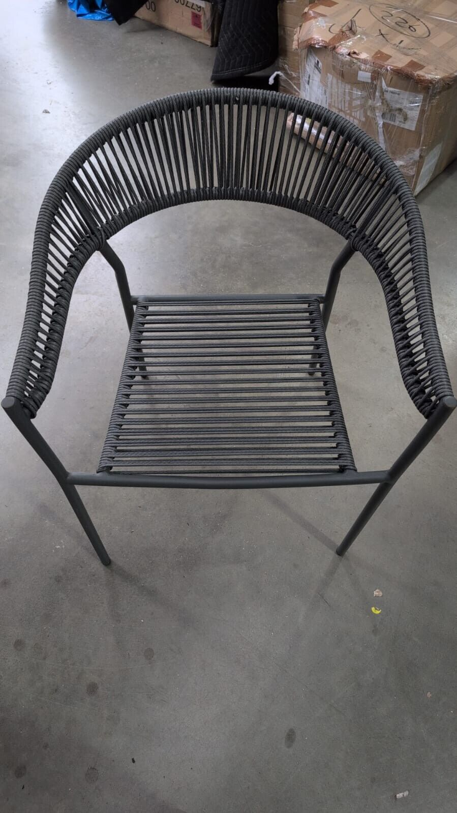 Kave Home Futadera stackable outdoor chair in gray synthetic cord, painted steel