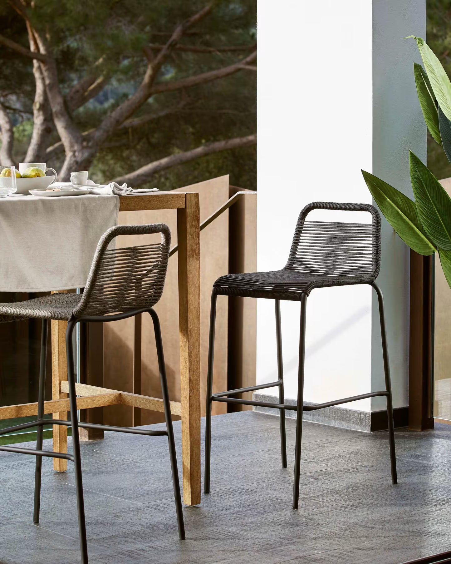 Kave Home Lambton stackable stool in black rope and black finish steel, 74 cm